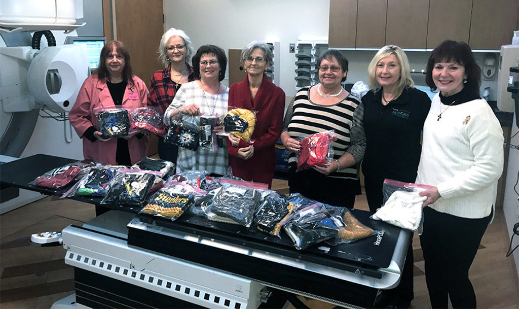Members of the Victory Hill Ladies Auxiliary stand with donated items