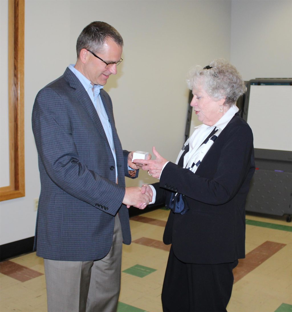 Regina Pappert, a volunteer who reached 4,500 hours, receiving her milestone pin from Todd Stoltz, vice chairman of the PH DuBois Board of Directors.